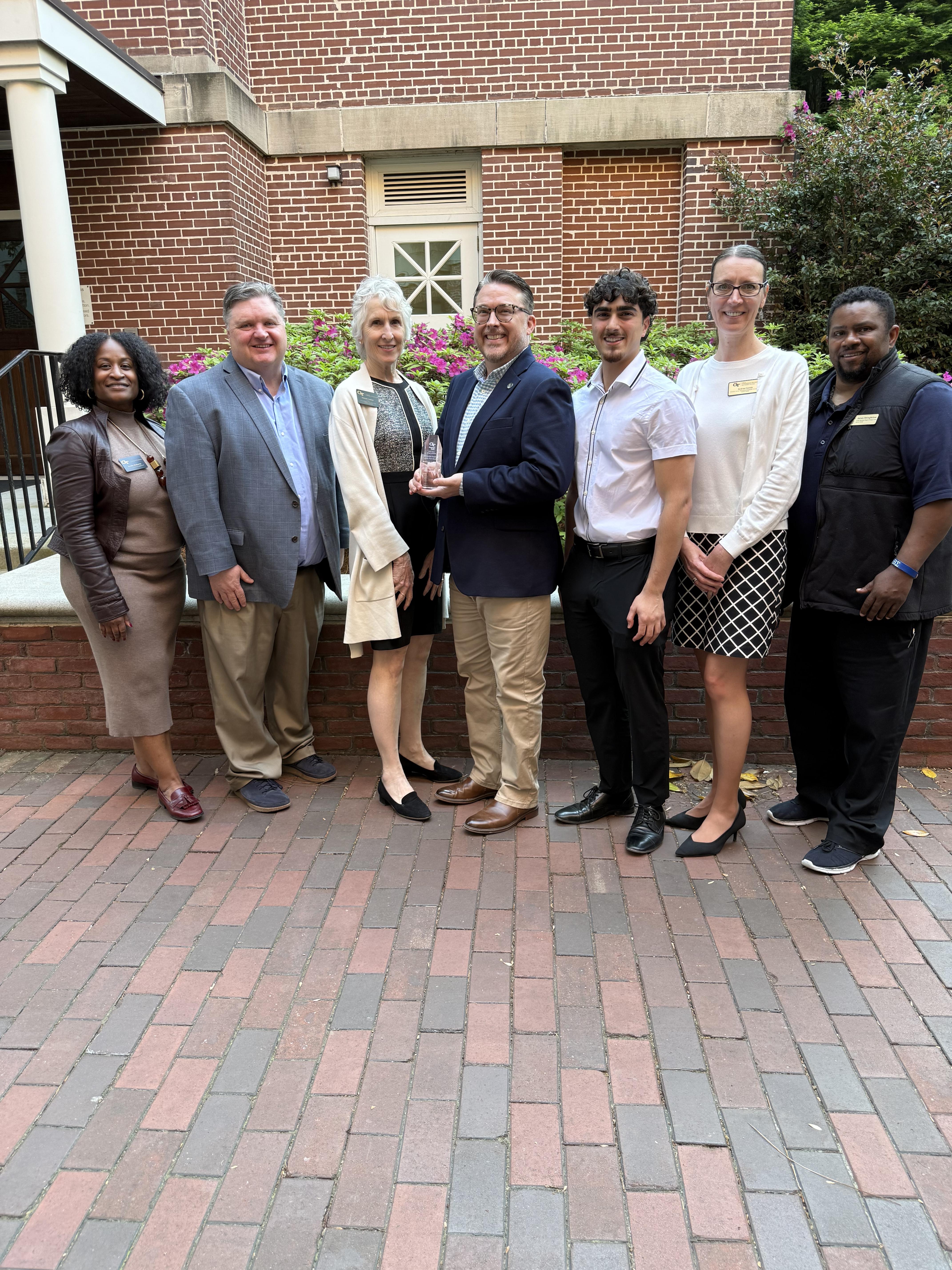 7 people standing in a line