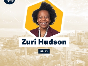Zuri Hudson (BIO 2013) Headshot of Zuri Hudson with a faded background showing Georgia Tech's campus