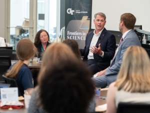 R. Shane Kimbrough speaks in front of room of people during a fireside chat