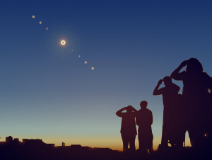Image of people looking at the sky during a solar eclipse