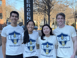 From L to R: Krishna Monroe, president of EMS at GT; Lianna Homrich, vice president of EMS at GT; Daeun “Esther” Lee, outreach director of EMS at GT; and Brandon Brigner, CPR officer of EMS at GT. Four students stand in front of emergency sign.