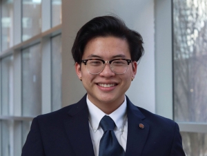 Elliot Huang is wearing a suit for this headshot