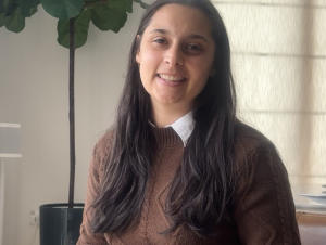 woman sitting in front of window
