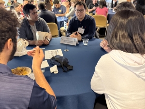 A group sits around a round table