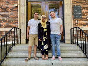 Zulfiqar, center, celebrating graduation with two mentors, who are current graduate students.