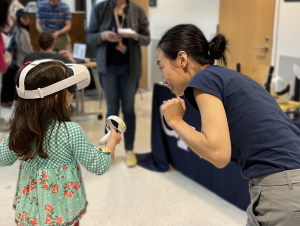 A young participant experiencing virtual reality for the first time.